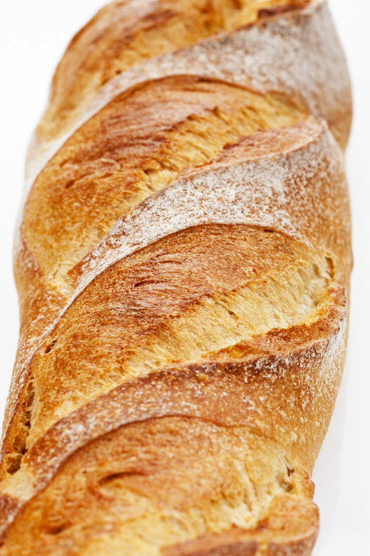 737x1106  Багет хлеб на белом фоне, крупным планом stock photo