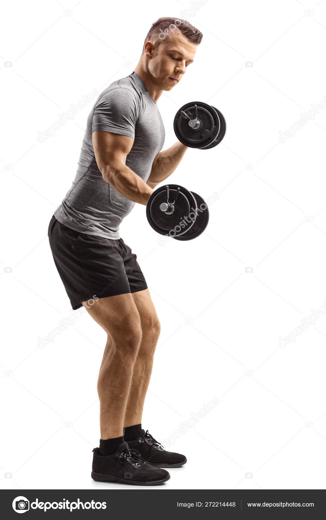 1067x1700  Молодой подъемник поднимает гантели stock photo by © ljsphotography 272214448