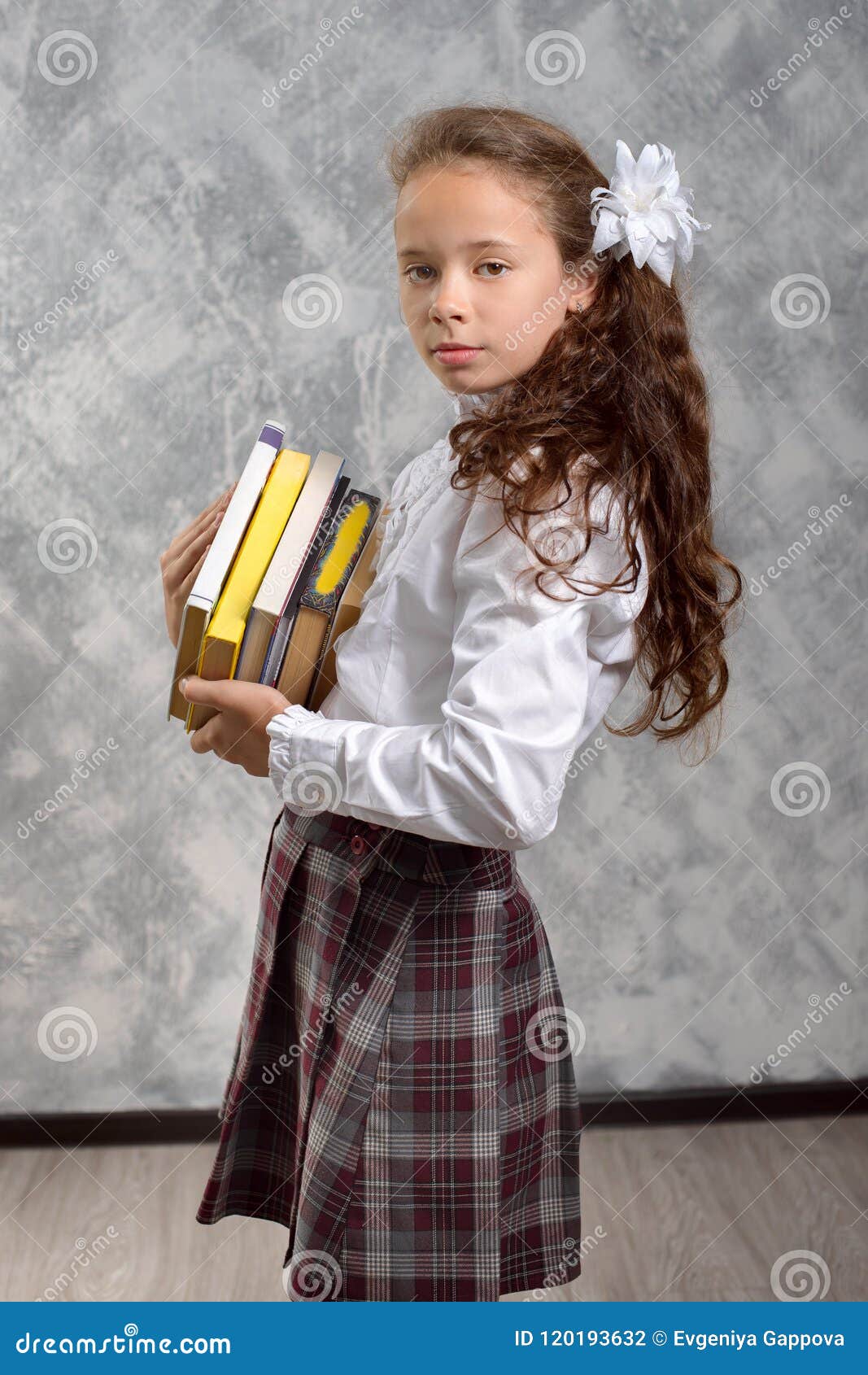 1067x1690  https://www.dreamstime.com/schoolgirl-school-uniform-books-extbooks-pose-light-gray-background back-to-school-new-school-yimage120193632