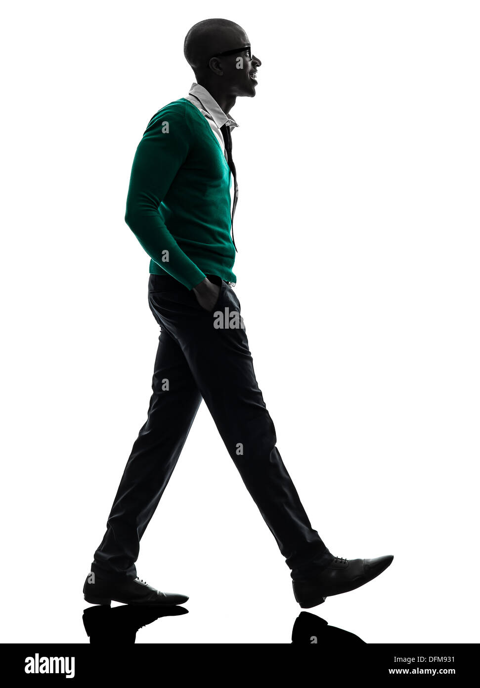 971x1390  Один африканский черный человек, идущий в силуэтной студии на белом фоне Stock Photo - Alamy