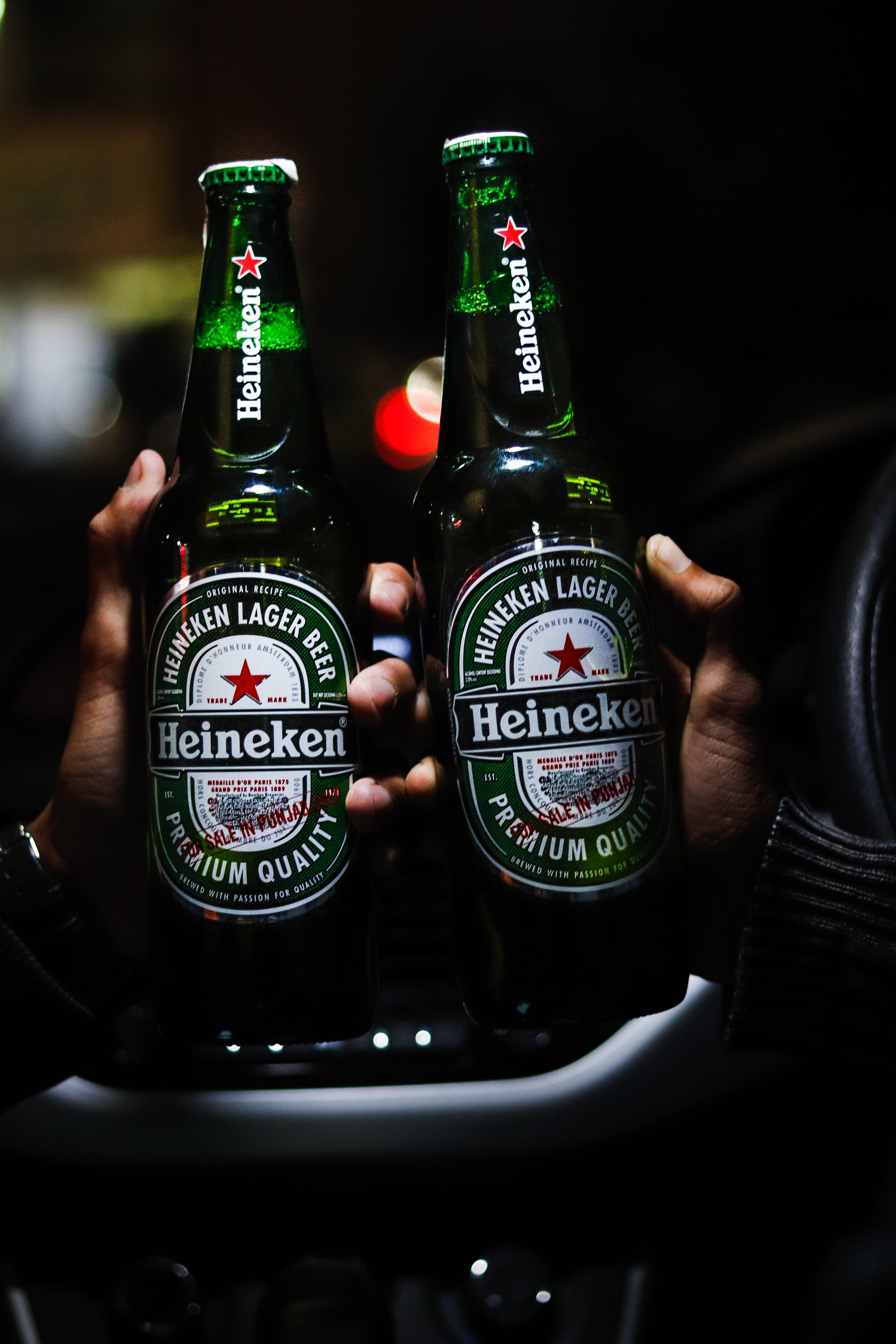 4000x6000  two #beer #bottles #of #heineken #green #beverages #car #city #bokeh # night #carholding #holding #in #hand # 5K #wallpaper # hdwall… | Heineken Beer Beer wallpaper